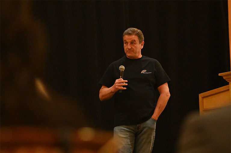 Vince speaking at conference